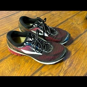 Brooks Ghost 10. Size 12. Main colors are black and pink.
